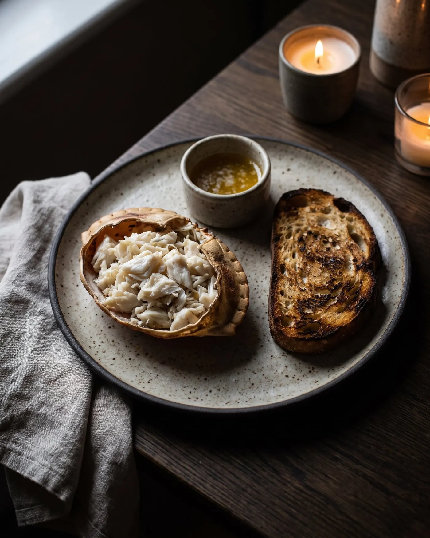 White crab meat in the shell with smoked butter and charred bread