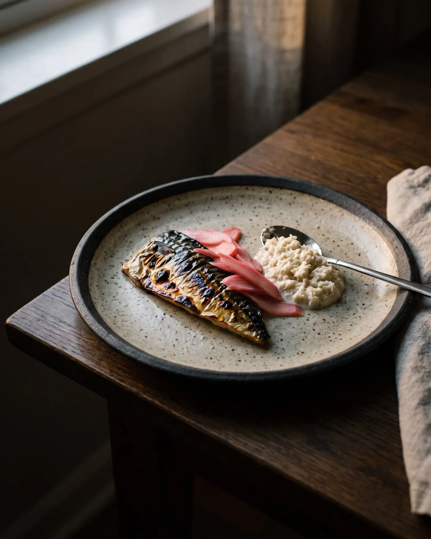 A blistered mackerel fillet with rhubarb and horseradish cream